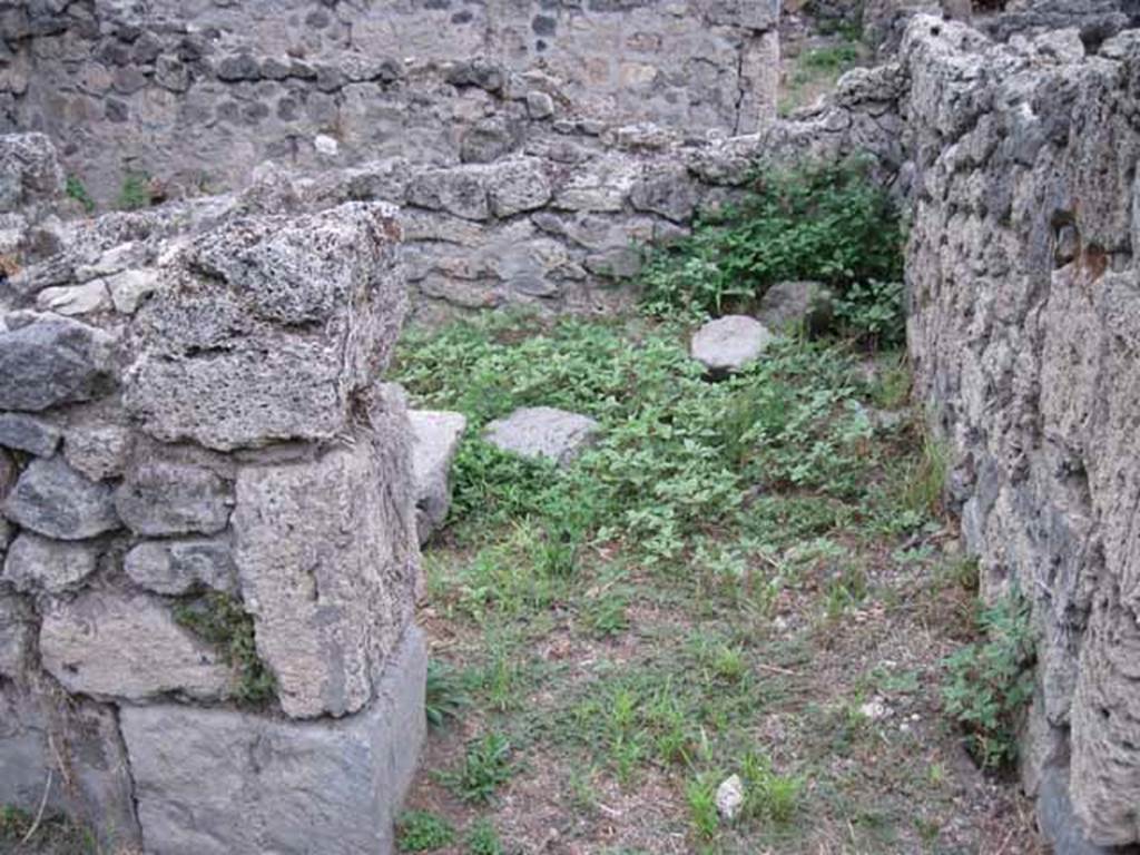 VIII.7.8 Pompeii. September 2010. Doorway to small storeroom on north side of corridor. Looking north. Photo courtesy of Drew Baker.
