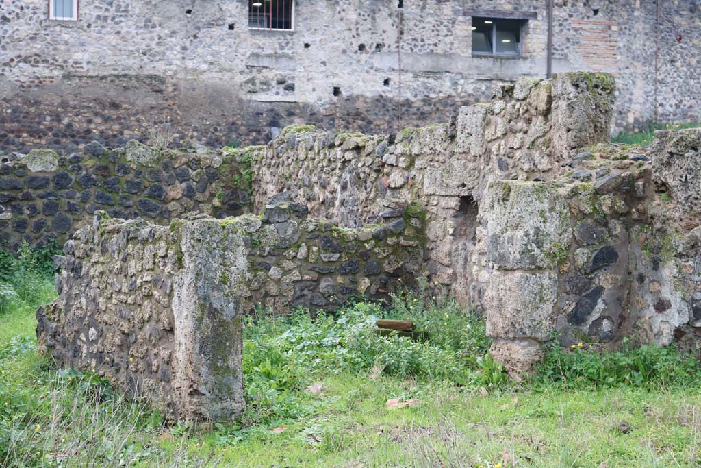 VIII.7.10 Pompeii. December 2018. 
Looking towards rear room of shop-room, with a niche/recess in the north wall? Photo courtesy of Aude Durand.
