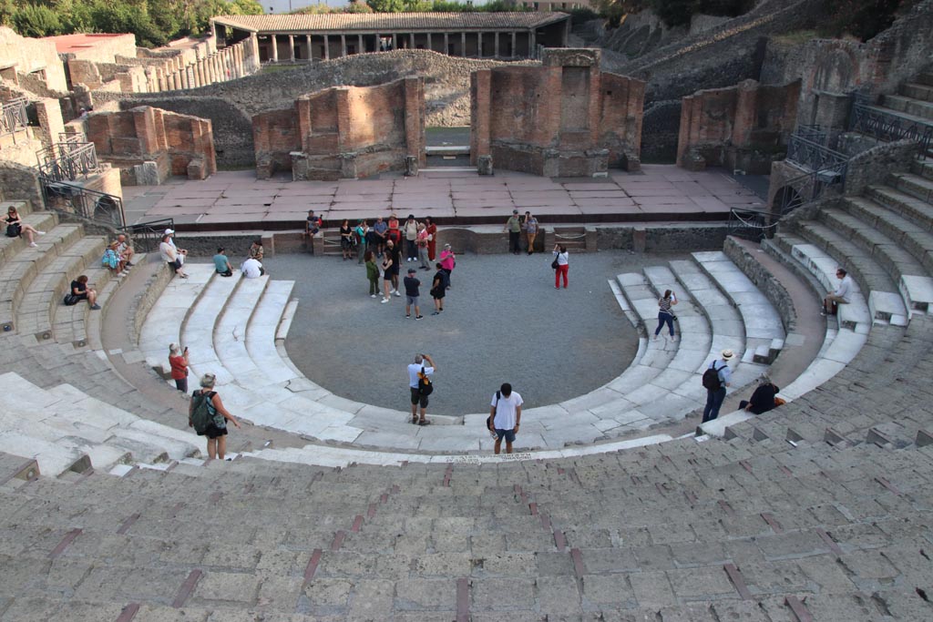 VIII.7.20 Pompeii. October 2023. Looking south across stage towards Gladiators Barracks. Photo courtesy of Klaus Heese.