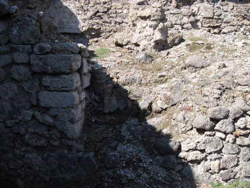 VIII.7.22 Pompeii. September 2010. Doorway into area, that was originally below the peristyle of VIII.7.24. Note column fragment presumably from collapse above. Photo courtesy of Drew Baker.
