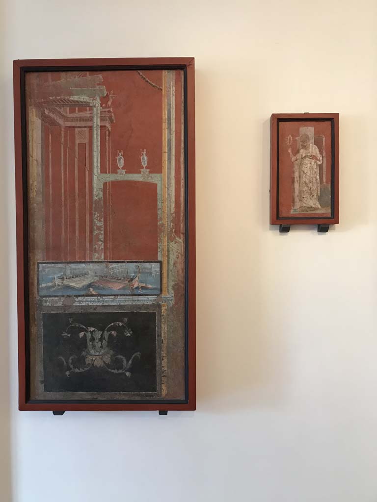 VIII.7.28 Pompeii. April 2019. Painted panels from south portico.
On the left is an architectural panel with naval scene.
Now in Naples Archaeological Museum. Inventory number 8541.
On the right is a priestess shaking a sistrum.
Now in Naples Archaeological Museum. Inventory number 8923.
Photo courtesy of Rick Bauer.
