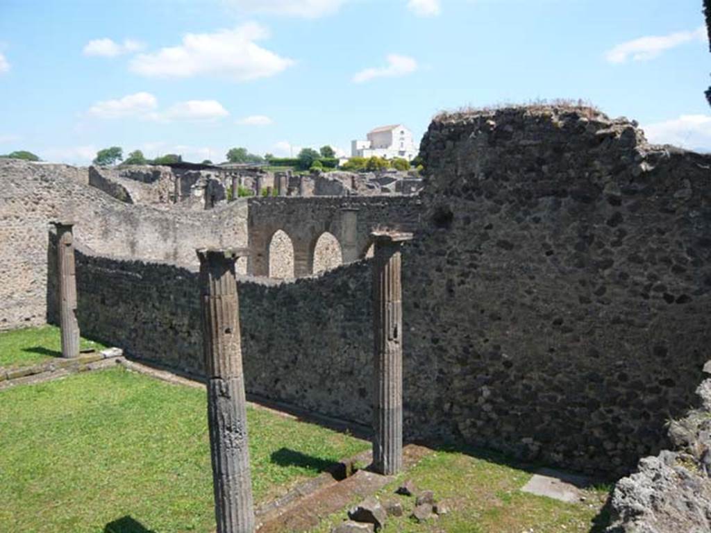 VIII.7.29 Pompeii. May 2011. Looking north-east from south colonnade, across the dividing wall into the Temple of Isis. Photo courtesy of Buzz Ferebee.
