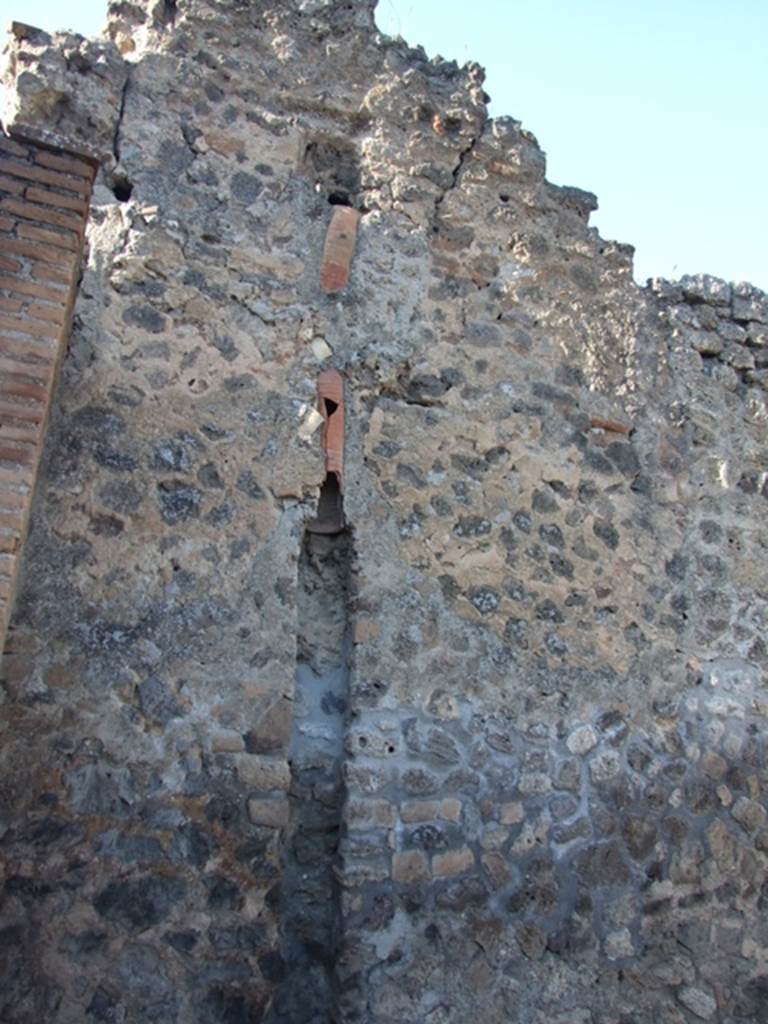 IX.1.6 Pompeii. March 2009. North-west corner of bar room.  Drainpipe from upper level.
