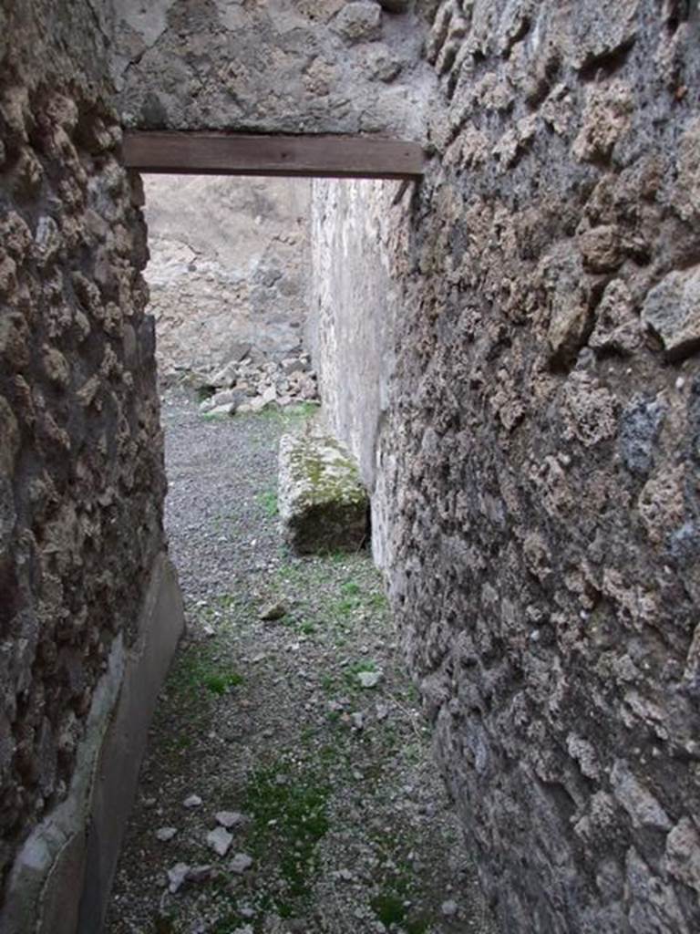 IX.1.7 Pompeii. December 2007. Looking north. Small corridor along east wall leading to room in north-east corner,  previously stairs to upper floor kitchen with cupboard under.


