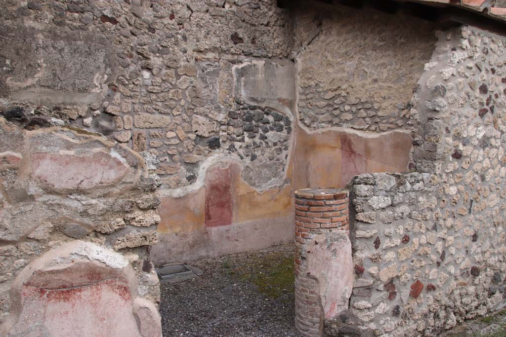 IX.1.12 Pompeii. October 2020. 
Looking south-east towards decorated walls in cubiculum in north-east corner of peristyle. Photo courtesy of Klaus Heese.
