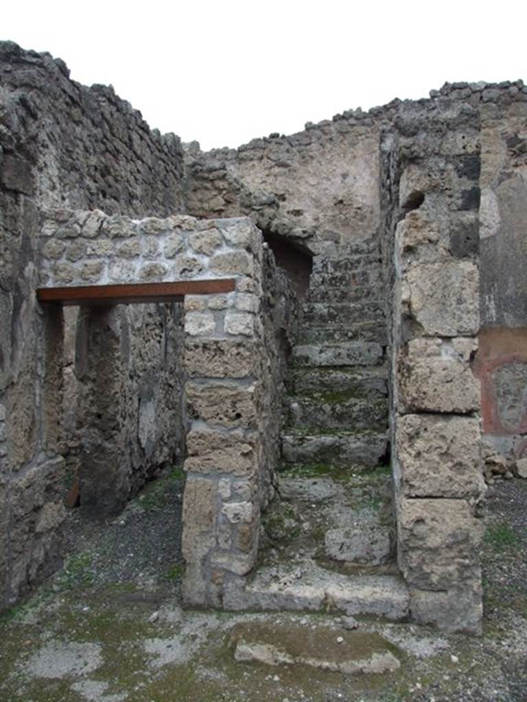 IX.1.12 December 2007.  Stone steps to upper floor. 