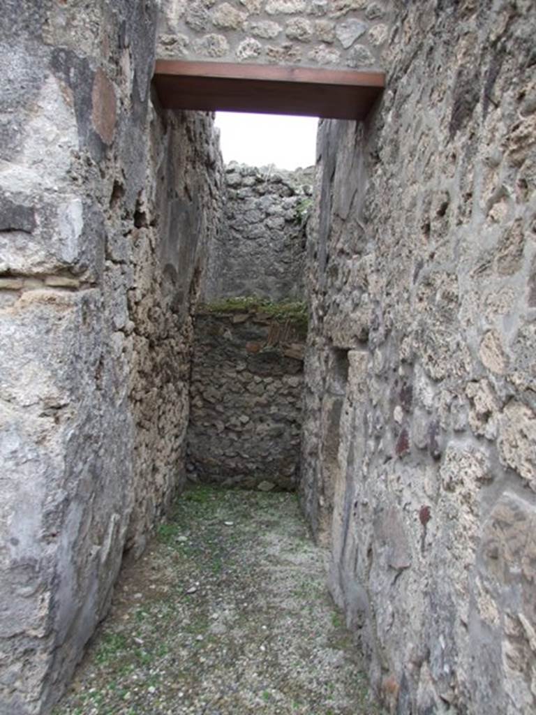 IX.1.12 Pompeii. December 2007. Small room that contained stairs of wood, on south side of portico, with small doorway into atrium.