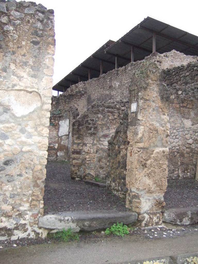 IX.1.18 Pompeii. December 2005. Entrance on Via dellAbbondanza.
According to Della Corte, graffiti found on the left of the entrance of IX.1.18, was

Lollia  cum  suis  (rogat)    [CIL IV 1053]

Della Corte also said that although he could not know what was worked or sold here, he knew that Lollia Successa was the proprietor of the business.
See Della Corte, M., 1965.  Case ed Abitanti di Pompei. Napoli: Fausto Fiorentino. (p. 242)
For the other graffiti found on the pilaster between IX.1.17 and IX.1.18, on the left, see IX.1.17.

Graffiti found in March 1858, on the pilaster between IX.1.18 and IX.1.19, on the right, were

M(arcum)  E(pidium)  [S(abinum)]
II vir(um)     [CIL IV 1056]

A(ulum)  Suettium
aed(ilem)  d(ignum)  r(ei)  [p(ublicae)]
o(ro)  v(os)  f(aciatis)    [CIL IV 1057]

Sabinum
[    [CIL IV 1058]

See Pagano, M. and Prisciandaro, R., 2006. Studio sulle provenienze degli oggetti rinvenuti negli scavi borbonici del regno di Napoli.  Naples : Nicola Longobardi.  (p. 175)

