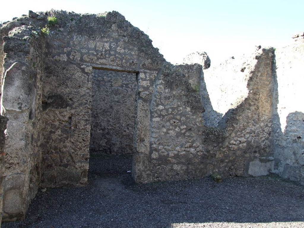 IX.1.18 Pompeii. December 2006. Looking west across yard towards doorway to workshop.
Originally this would have been looking west across atrium towards a doorway to the triclinium.
