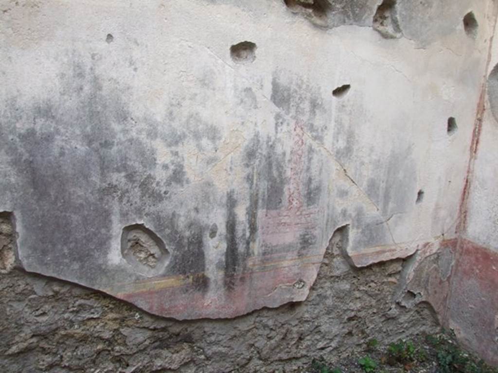 IX.1.22 Pompeii. December 2007. Room 22, south wall with remains of painted decorations.