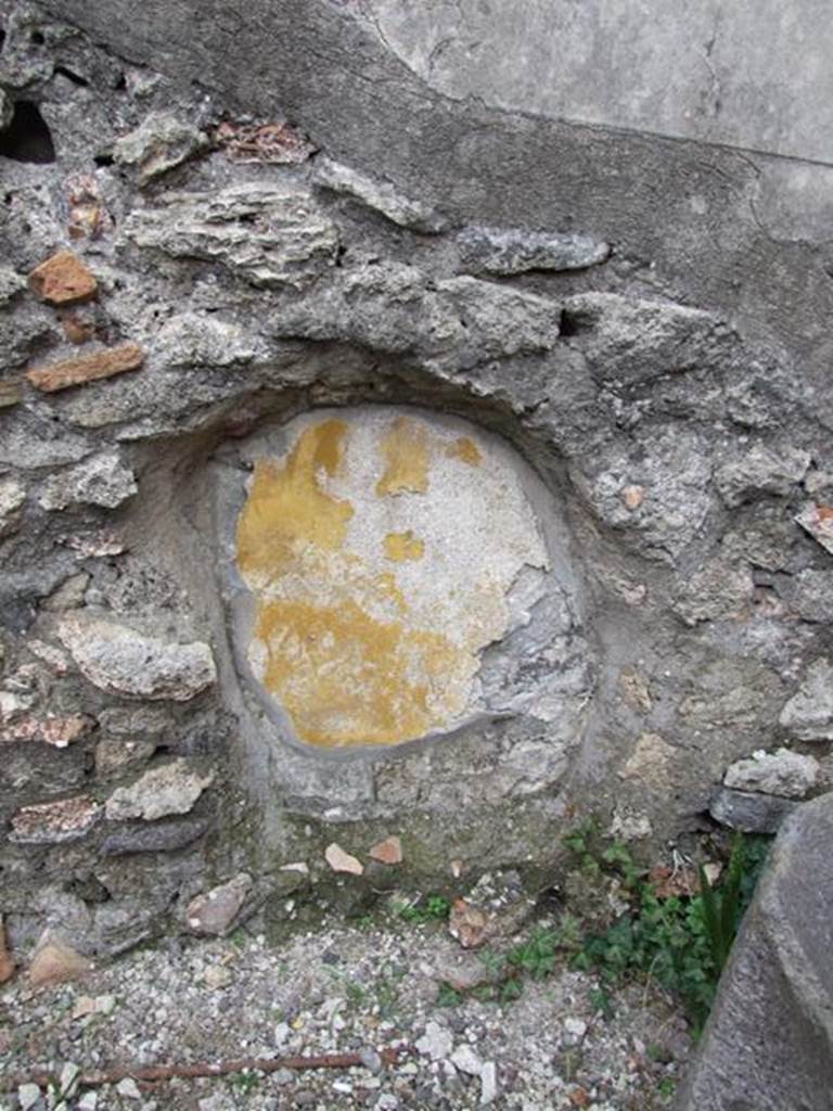 IX.1.22 House of M. Epidi Sabini.  December 2007.  Room 24.  Second Peristyle.  Painted yellow plaster in recess in south east corner of peristyle.