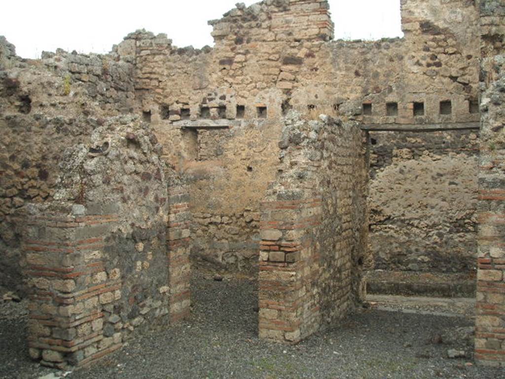 IX.1.32 Pompeii. May 2005. North-west corner of atrium. A doorway to a cubiculum can be seen on left, then the doorway to triclinium, then entrance doorway looking north into Vicolo di Balbo. 
