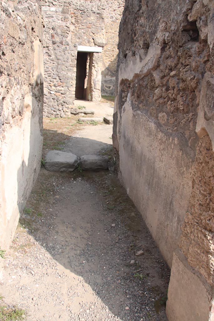 IX.2.7 Pompeii. October 2023. 
Looking east along corridor (d) towards rear rooms. Photo courtesy of Klaus Heese.
