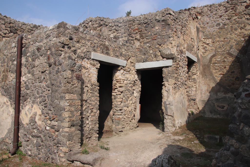 IX.2.7 Pompeii. October 2023. 
Looking north-east towards doorways to rooms (i), (k), and garden area (h). on right. Photo courtesy of Klaus Heese.
