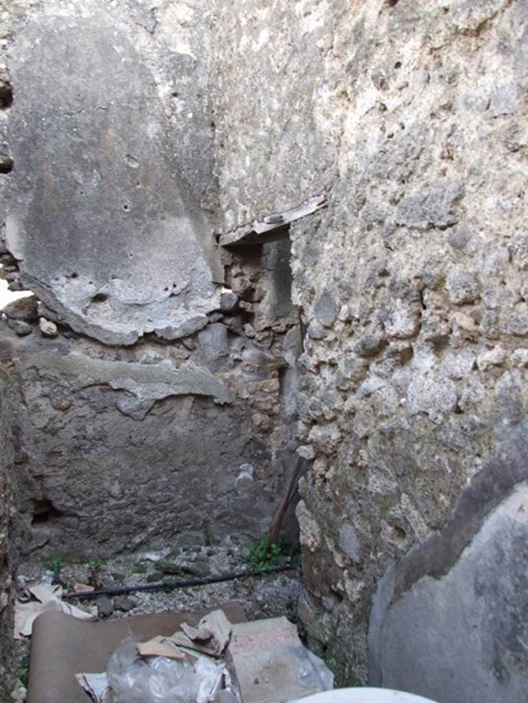 IX.2.16 Pompeii.  March 2009.  South west corner of small room with steps to upper floor.

