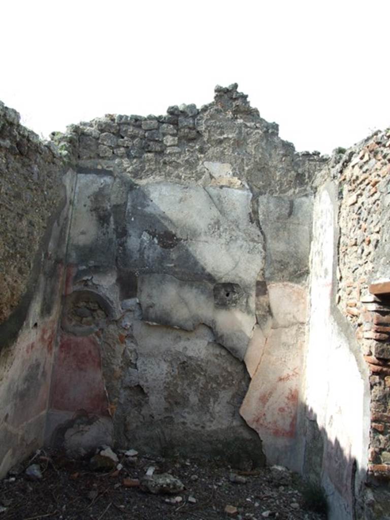 IX.2.18 Pompeii. March 2009. Room 10, north wall of cubiculum or triclinium.
This room would have had a vaulted ceiling with holes for support of the beams in this north wall.
The zoccolo would have been black, the side panels of the middle zone would have been violet/purple.
The large central panel of the middle zone was white, with the painting of Paris, Helen and Venus.
See Sogliano, A., 1879. Le pitture murali campane scoverte negli anni 1867-79. Napoli: Giannini. (p. 108, no.568)
