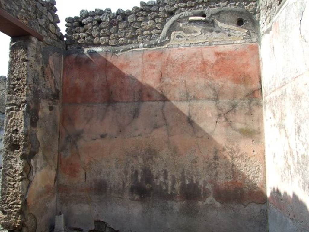 IX.2.18 Pompeii. March 2009. Room 3, triclinium or a cubiculum. North wall with remains of vaulted ceiling and stucco decoration. The zoccolo was colourless and faded. The middle zone of the walls were red, they were divided into panels, in each of which was a painting on a red background which was already fully faded at the time of discovery, whilst one could hardly distinguish the subject of the central one with Io and Argo. The upper zone of the walls were also red, the vaulted lunette was bordered by a moulded plaster cornice.
See Bragantini, de Vos, Badoni, 1986. Pitture e Pavimenti di Pompei, Parte 3. Rome: ICCD. (p.420).
According to Fiorelli, on the north wall was a painting of Io and Argo, Io sitting with her hand on her chest with Argo standing at her side.
See Fiorelli, G: Descrizione di Pompei, 1875, (p.385).
According to Trendelenburg, originally this room would have had three paintings on each of its side walls, and one painting on the wall that looked onto the entrance. Only the one painting was preserved, but so badly battered that the colours were completely lost and only the outlines of the figures remained visible. However with certainty, the subject of the painting was recognised as being Io and Argo.
See BdI, 1871, (p.195)
