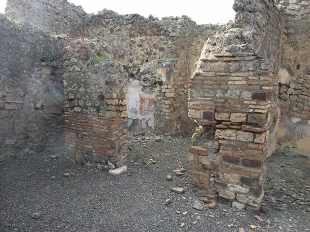 IX.2.21 Pompeii. March 2009. Doorways to rooms 13 and 14, from north portico.  According to Boyce, in these two cubicula many objects were found including jewellery and four bronze statuettes:
One was Abbondanza holding a cornucopia in the left hand and a patera in the right  probably the Genius -
and Minerva, helmeted and holding a spear in the right hand, and a shield on the left arm.
Also found were the two Lares, each holding rhyton and patera.
See Boyce G. K., 1937. Corpus of the Lararia of Pompeii. Rome: MAAR 14. (p.81)
Boyces reference was given as Giorn. Scavi, N.S., ii, 1872, 281. 
