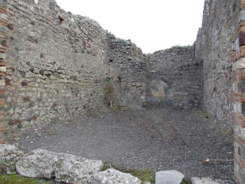 IX.2.23 Pompeii. March 2009. Looking south to rear room. The stairs to the upper floor would have been on the left side. The latrine would have been beneath the stairs, in the south-east corner of the shop-room.

