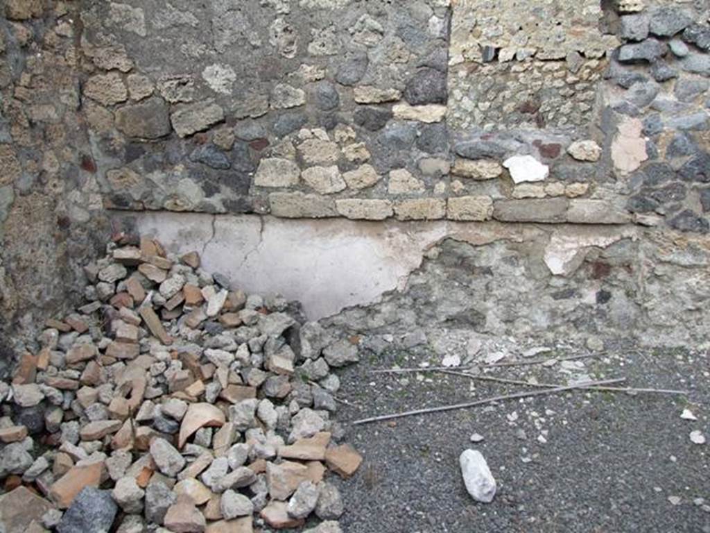 IX.2.24 Pompeii. March 2009. North-east corner in triclinium on west side of corridor. In the east wall is a recess for a couch/bed and square window onto corridor.
