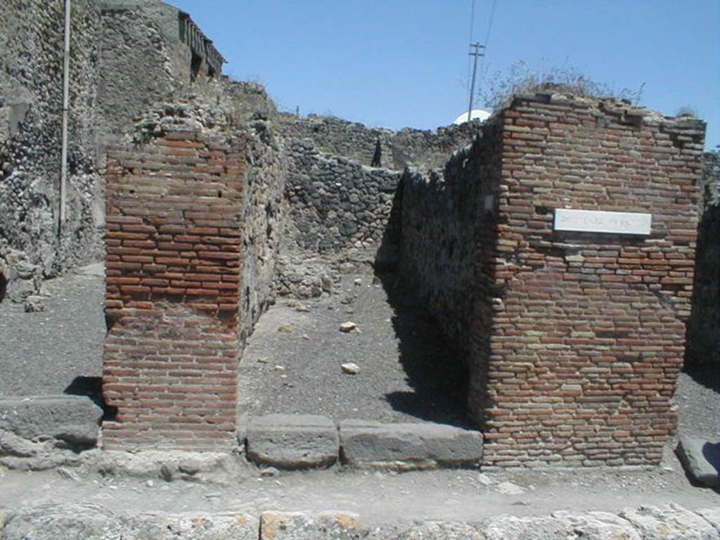 IX.3.8 Pompeii. May 2005. Entrance. According to Della Corte, found on the pilaster on the right, between IX.3.8 and IX.3.9 was the graffiti
Multum  pistores  rogant     [CIL IV 886]  
This graffiti was written in support of the candidate Giulio Polibio, and Della Corte thought  it was a collective recommendation by the two bakeries on either side of the street.
See Della Corte, M., 1965.  Case ed Abitanti di Pompei. Napoli: Fausto Fiorentino. (p. 159)
Also found on this pilaster was a mutilated graffiti 
Titus ?   rog(at)     [CIL IV 884]
See Della Corte, M., 1965.  Case ed Abitanti di Pompei. Napoli: Fausto Fiorentino. (p.162)
