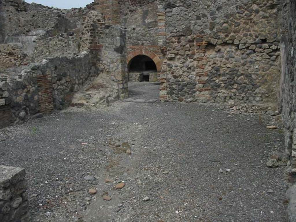 IX.3.10 Pompeii. May 2003. Looking east across shop, for selling the bread made at the bakery at the rear of shop. Photo courtesy of Nicolas Monteix.
