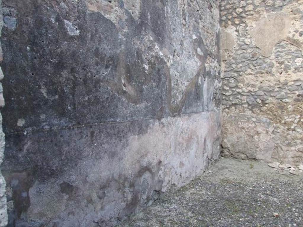 IX.3.13 Pompeii.  March 2009.  Triclinium.  West wall, with remains of plaster.