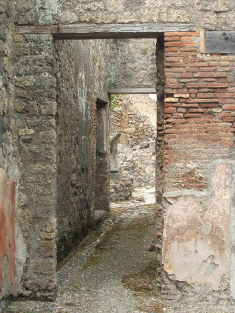 IX.3.19. Taberna T. Genialis.  May 2005. Room 10.  Looking north along corridor to bakery.