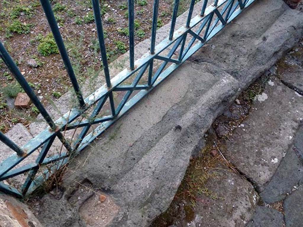 IX.4.15 Pompeii. September 2011. Entrance doorway sill. Photo courtesy of Michael Binns.