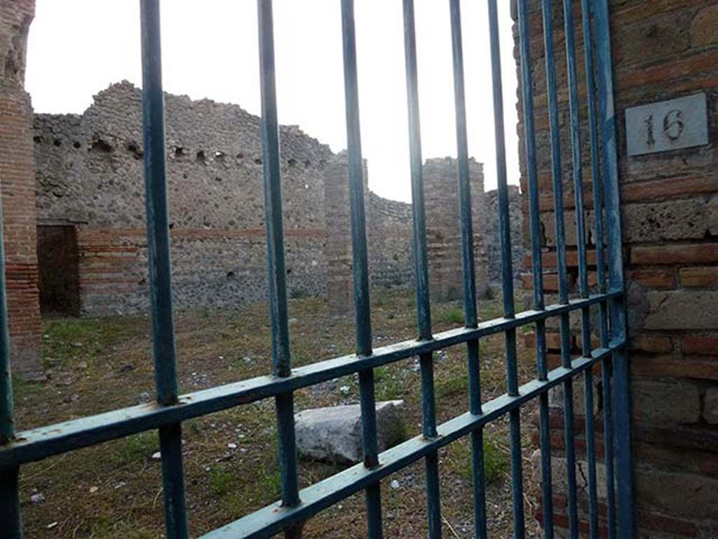 IX.4.16 Pompeii. September 2011. Open area u with three pilasters that may have been supports for a roof. The entrance to the corridor into apodyterium or vestibule i can be seen in the wall at the rear. Photo courtesy of Michael Binns.