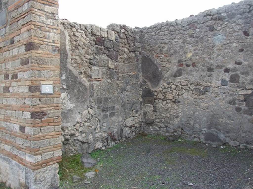 IX.5.3 Pompeii. December 2007. East side of shop with base for steps to upper floor.