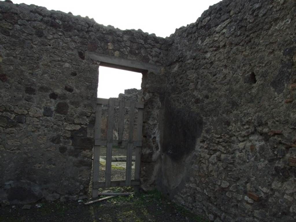 IX.5.3 Pompeii. December 2007. West side of shop with doorway in south-west corner, leading into atrium of IX.5.2.