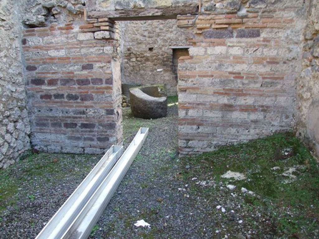 IX.5.4 Pompeii. December 2007. Room c, in bakery area, looking south towards doorway to room d.

