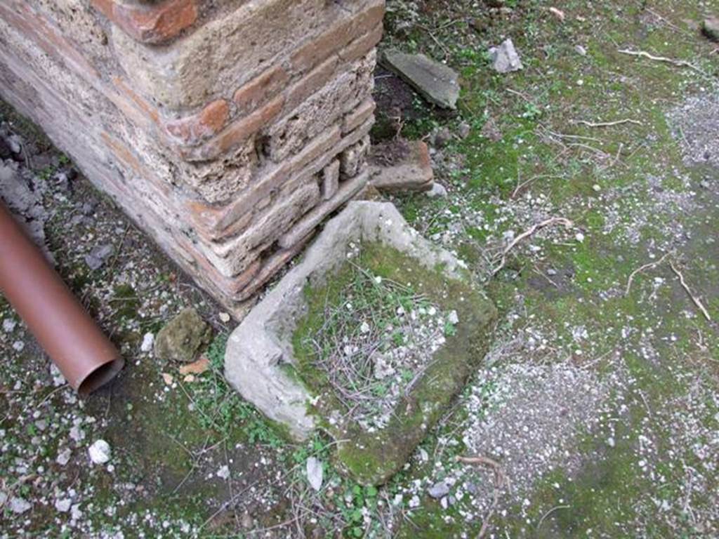 IX.5.4 Pompeii. December 2007. Room e, base of pilaster in bakery area.