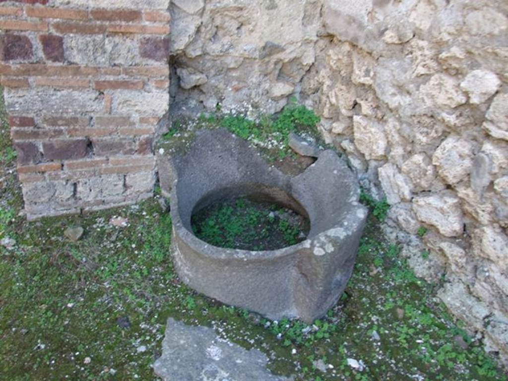 IX.5.4 Pompeii. December 2007. Fragment of lava mill-stone in bakery area.