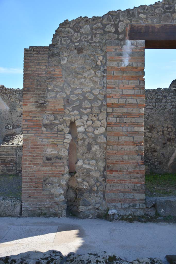 IX.5.8, on left, and IX.5.7, on right, Pompeii. March 2017. 
Looking south to pilaster between two entrance doorways, with terracotta downpipe. 
Foto Christian Beck, ERC Grant 681269 DCOR.
