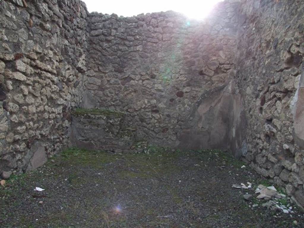 IX.5.7 Pompeii. December 2007. South wall of shop. In the south-east corner, at the rear on the left side, can be seen the base of the three steps to the upper floor.
