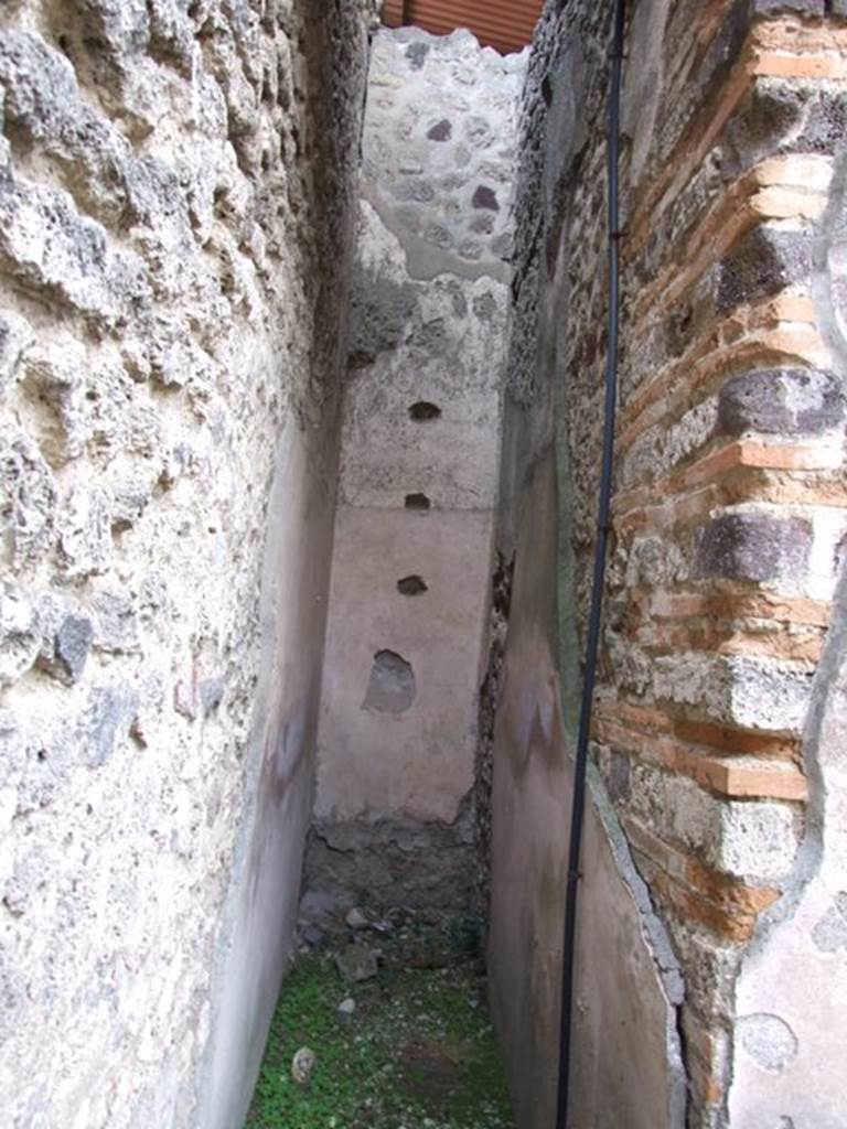 IX.5.12 Pompeii. December 2007. Narrow area in south-east corner of shop. Site of steps to upper floor?
