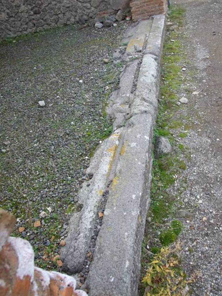 IX.5.12 Pompeii. December 2007.Entrance sill or threshold with grooves for shutters.