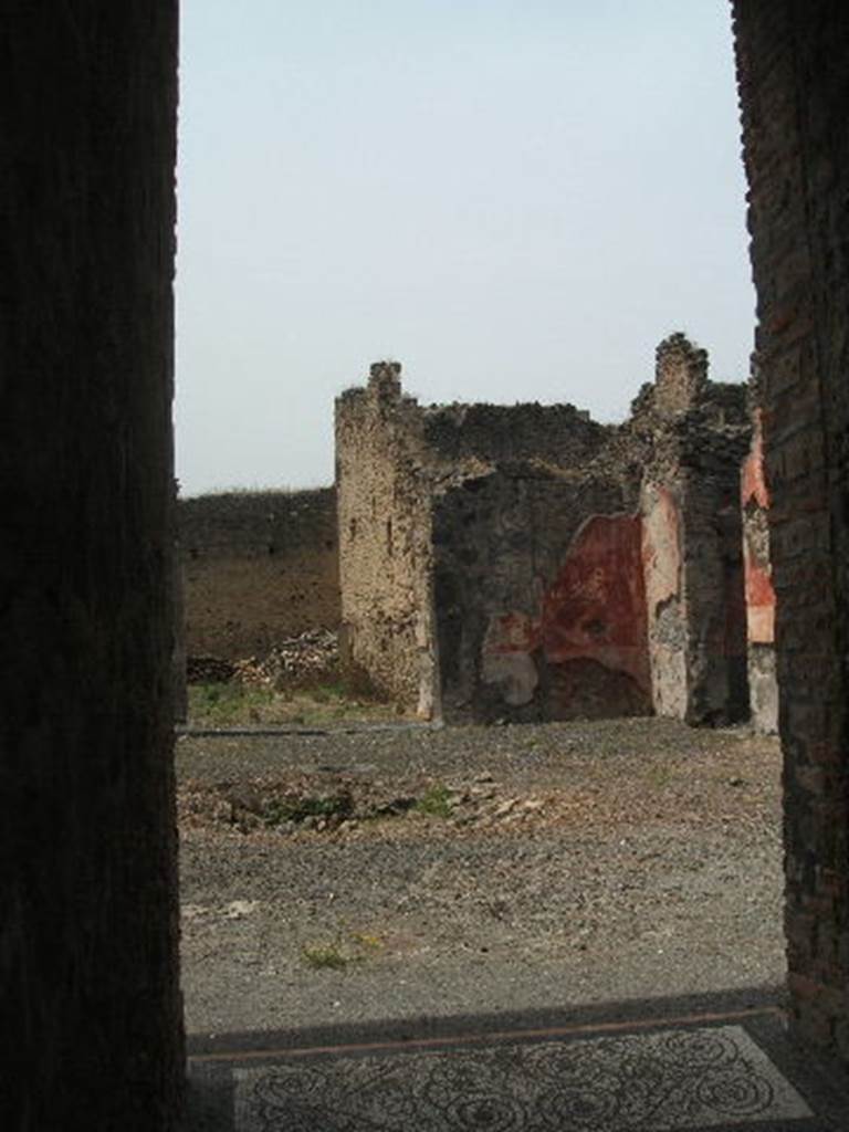 IX.5.14 Pompeii. May 2005. Looking north-west across atrium "b". The doorway to the peristyle can be seen on the left. The doorway to a triclinium can be seen on the right (not photographed) According to PPP, this room is room f, and found in it were the under-mentioned paintings. According to Richardson, found in triclinium o were the following paintings.  All now in Naples Archaeological Museum.
Pyramus and Thisbe,   (Naples Inventory number 111483), 
Pair of men before an enthroned queen (Aeneas before Dido?)   (Naples Inventory number 111480),  Bacchus and  Ariadne with thiasus   (Naples Inventory number 111481). See Richardson, L., 2000. A Catalog of Identifiable Figure Painters of Ancient Pompeii, Herculaneum. Baltimore: John Hopkins. (p.153)  See Bragantini, de Vos, Badoni, 1986. Pitture e Pavimenti di Pompei, Parte 3. Rome: ICCD. 
