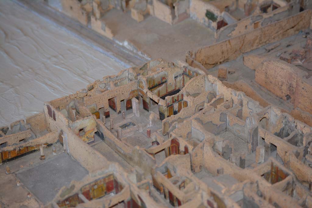 IX.5.16, on left, IX.5.17, centre left, and IX.5.18, Pompeii. July 2017. Detail from south side of insula. Looking south-west.
From cork model in Naples Archaeological Museum.
Foto Annette Haug, ERC Grant 681269 DÉCOR.

