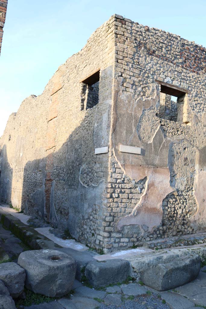 IX.5.19 Pompeii, on right. December 2018. 
Looking north-east to front façade on unnamed roadway, on right, at junction with Vicolo di Tesmo, on left.
Photo courtesy of Aude Durand.

