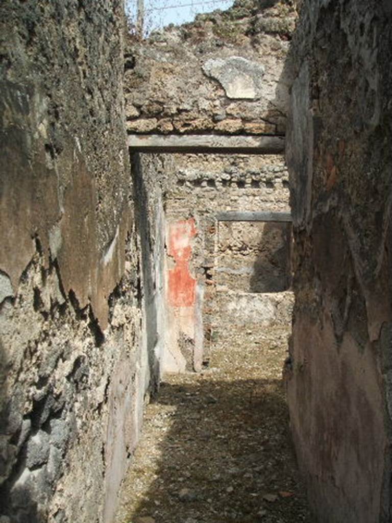 IX.6.d Pompeii. May 2005. Looking north along entrance corridor towards atrium “c” and triclinium “e”. Found on the west (left) wall of the atrium “c” was a wall painting of Theseus abandoning Ariadne. See Sogliano, A., 1879. Le pitture murali campane scoverte negli anni 1867-79. Napoli: (p.96, 532) 
See Schefold, K., 1957. Die Wande Pompejis. Berlin: De Gruyter. (p.266)
See Schefold, K., 1962. Vergessenes Pompeji. Bern: Francke. (p.89, Taf 52,2) 
A wall painting of Polyphemus was found in room “c”, on the north side of the pilaster between rooms “a” and “b”.  According to Sogliano originally it would have covered the entire space on the pilaster, but only a fragment was preserved (1,13 high x 1,10 wide).
See Schefold, K., 1957. Die Wande Pompejis. Berlin: De Gruyter. (p.266)
See Sogliano, A., 1879. Le pitture murali campane scoverte negli anni 1867-79. Napoli: (p.78, nos.473)
