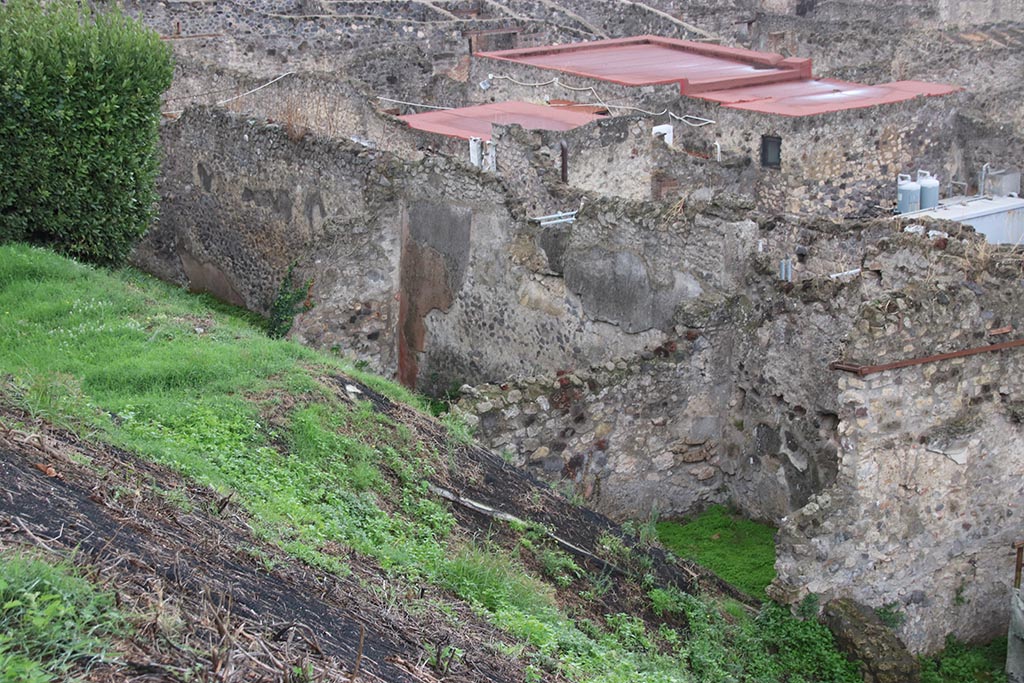 IX.7.12 Pompeii. October 2024.
Looking south along west wall of Insula, room 3, atrium, on left, room 5, triclinium, in centre, room with entrance doorway at IX.7.14, on right. 
Photo courtesy of Klaus Heese. 
