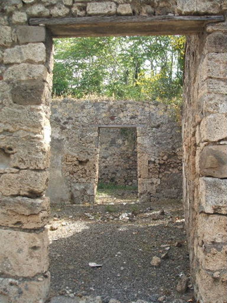 IX.7.19 Pompeii. May 2005. Looking east from entrance doorway into room b, the atrium with doorway to room g, triclinium, ahead. According to Mau, this narrow atrium had an impluvium but was without a fauces, or entrance corridor. See Mau, BdI, 1883, (p.78)