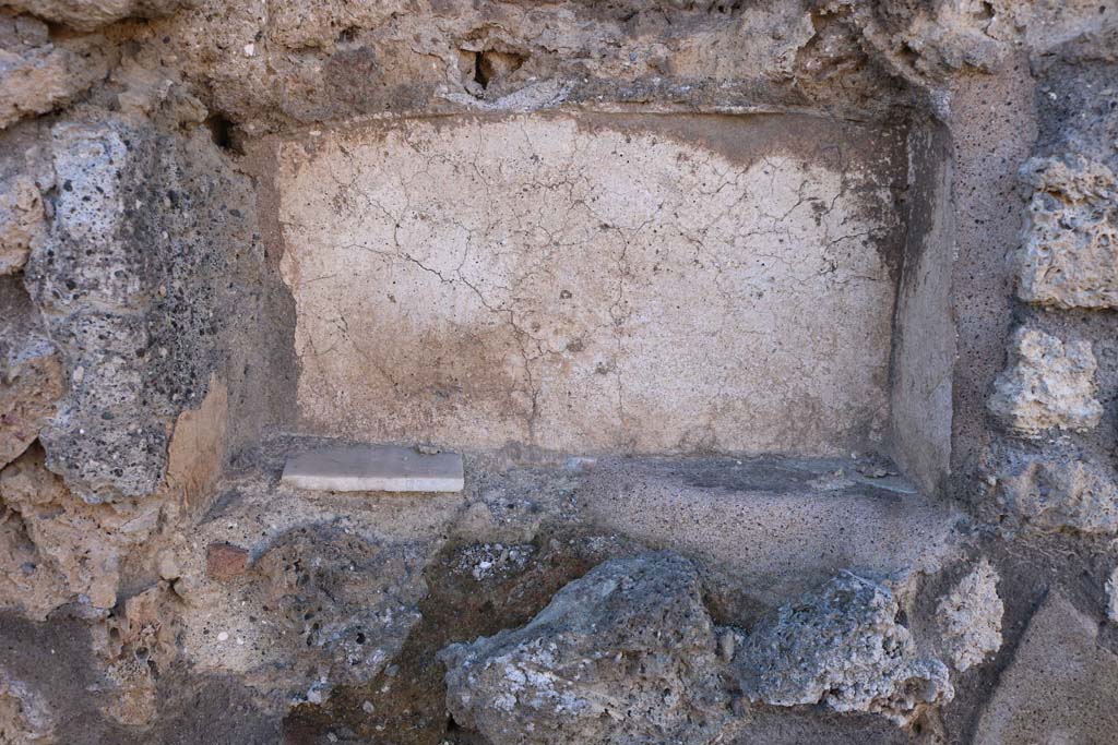 IX.7.24 Pompeii. December 2018. Looking towards lower recess/niche set into west wall at end of counter. Photo courtesy of Aude Durand