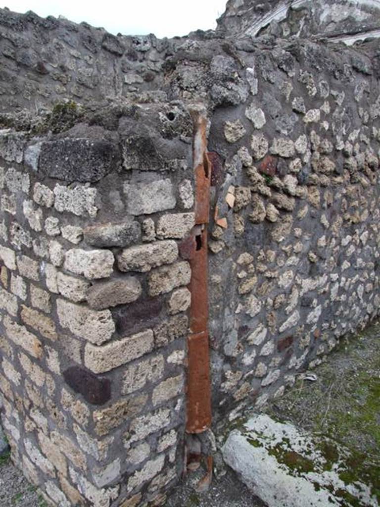 IX.8.6 Pompeii. March 2009. Room 52, downpipe on north side of ala on east side of atrium of IX.8.3. 
