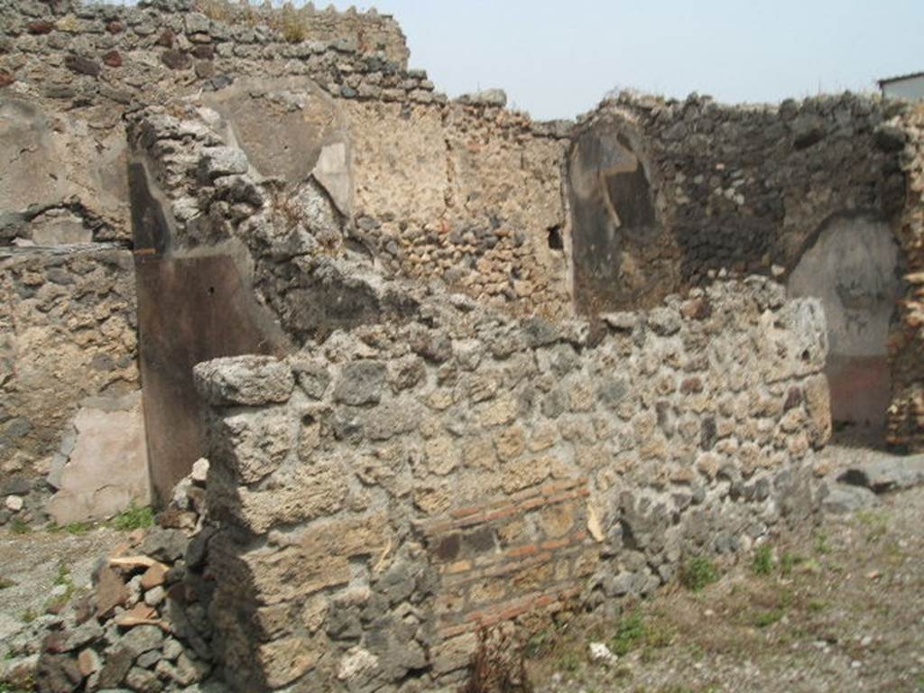 IX.8.c Pompeii. May 2005. Two doorways to rooms in north-west corner of peristyle.