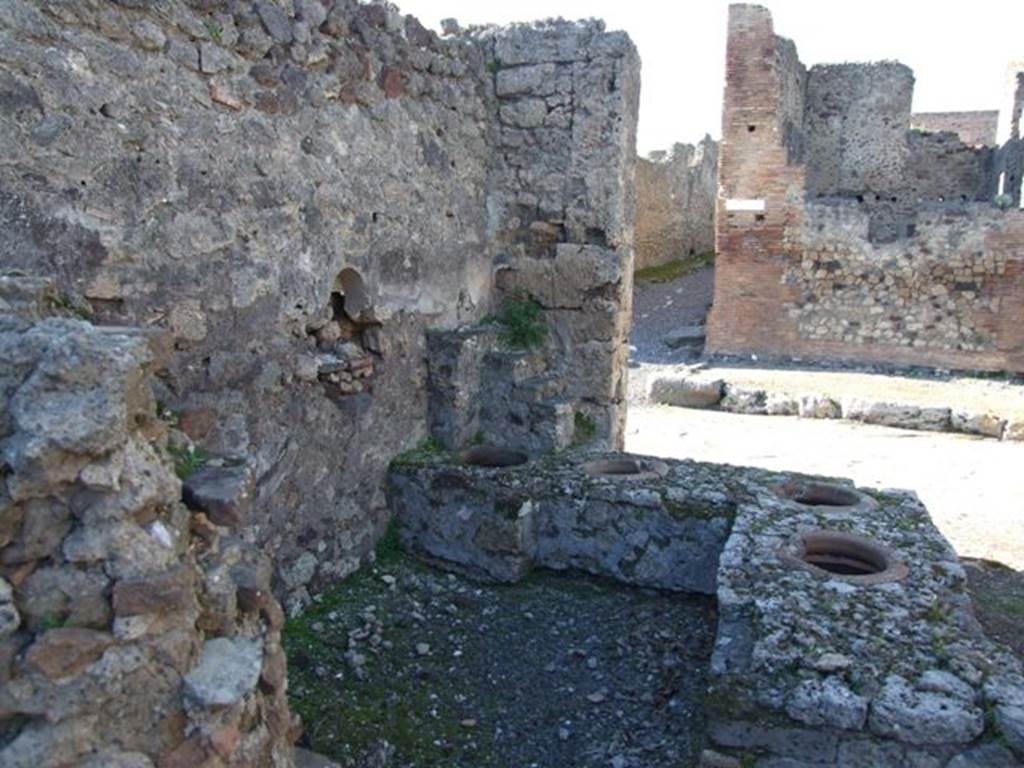 IX.9.1 Pompeii.  March 2009.  Looking north at counter area, from rear.