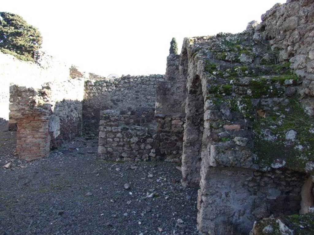 IX.9.2 Pompeii. March 2009. Looking south across atrium towards doorway to cubiculum “d” at rear, arched recesses and stairs.